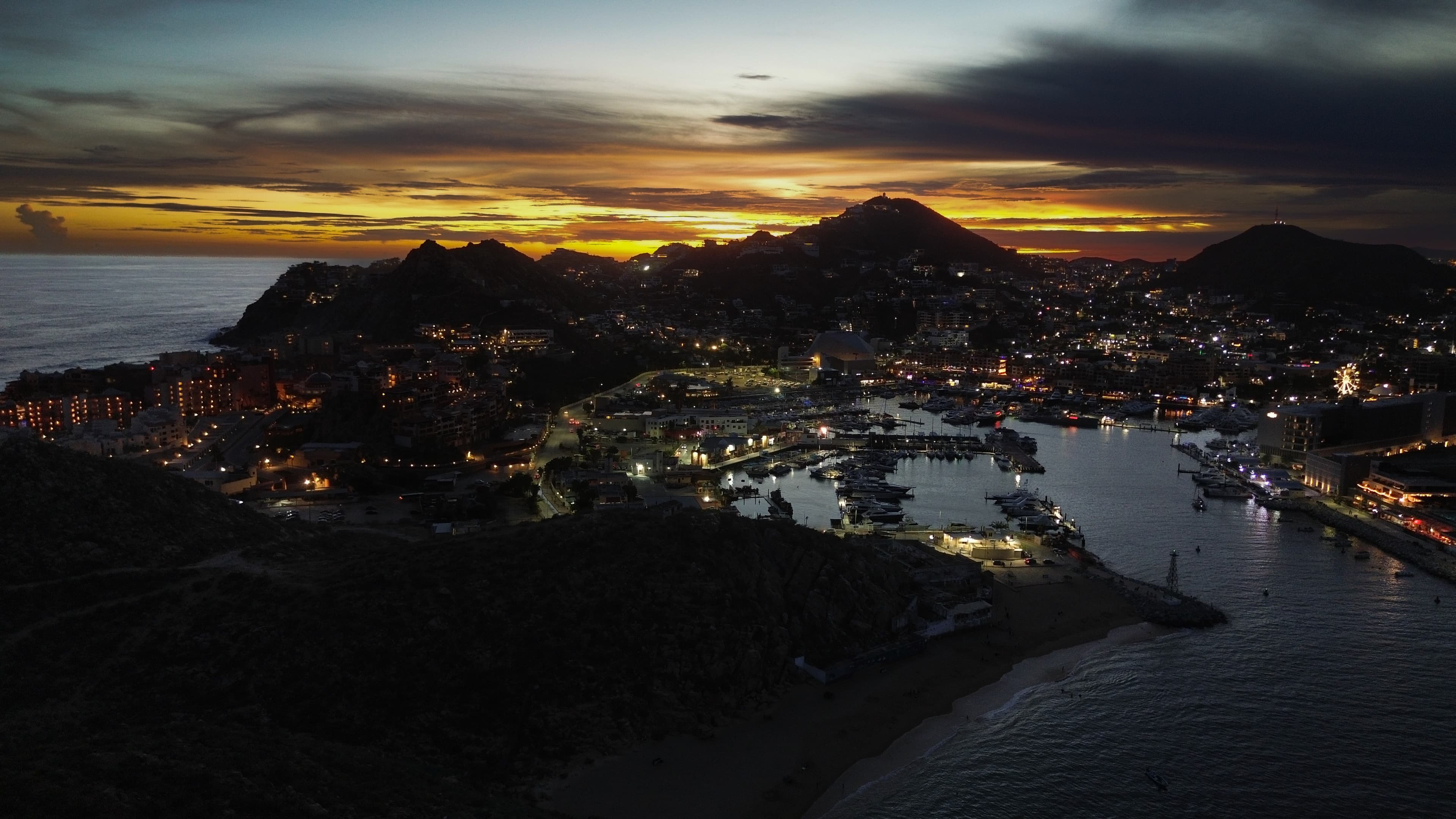 Cabo San Lucas marina with yachts, restaurants, and nightlife — the vibrant heart of Los Cabos