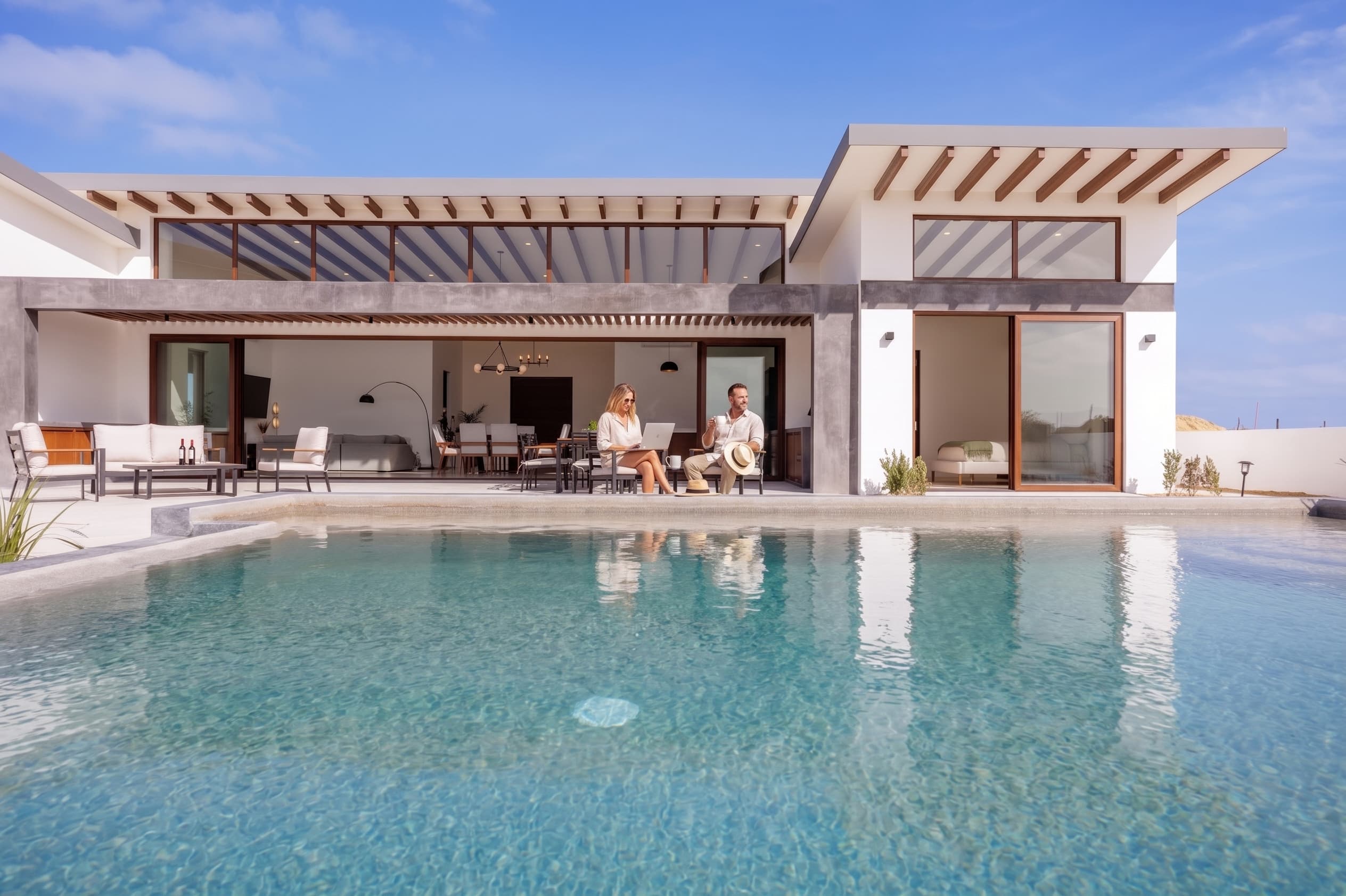 Expats living the Cabo San Lucas lifestyle with Mexico permanent residency — enjoying a terrace ocean view over the Sea of Cortez