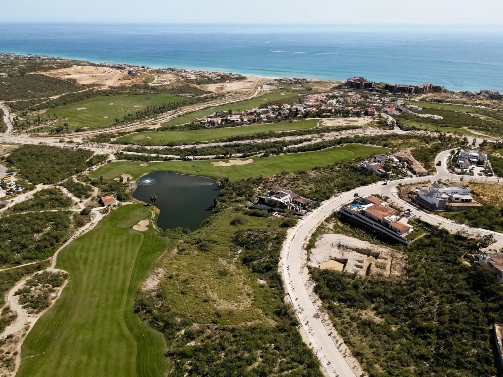 Aerial view of El Altillo homes and homesites near the golf course and ocean in Puerto Los Cabos