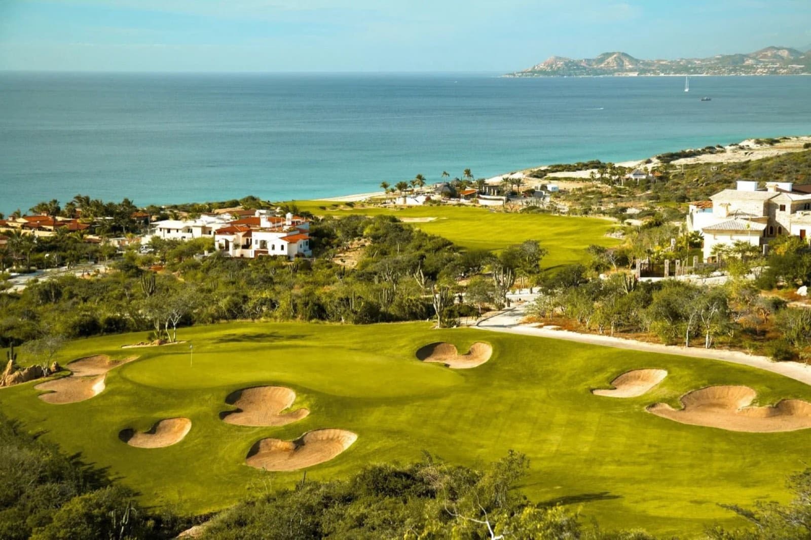 Golf green with bunkers above the Sea of Cortez at Puerto Los Cabos