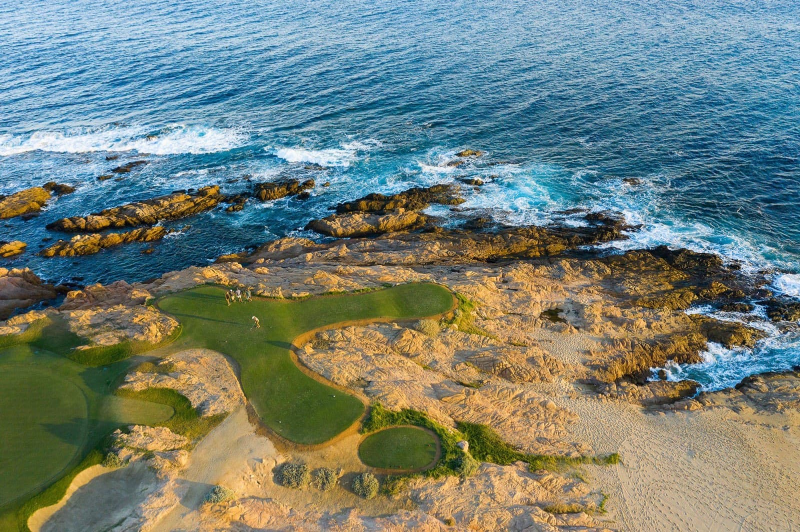 Oceanfront golf green on the rocky Sea of Cortez coastline at Cabo del Sol, Los Cabos