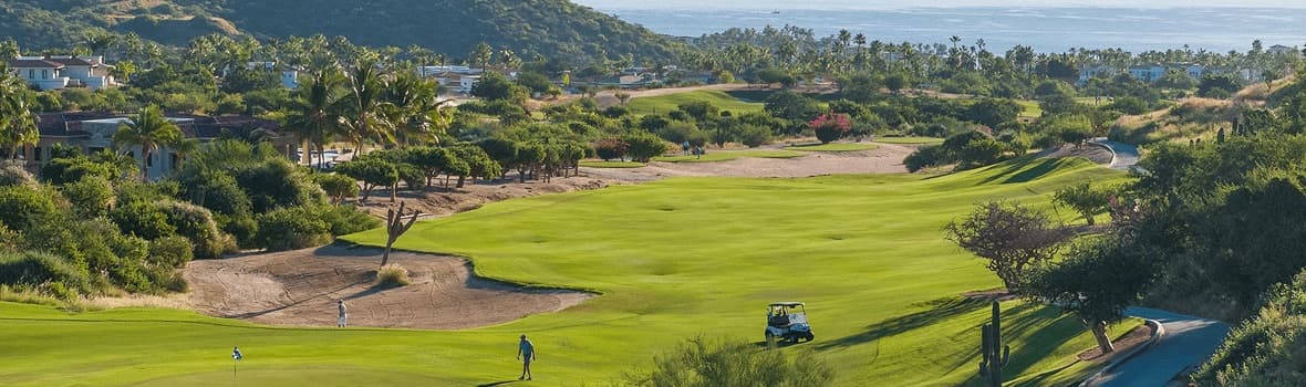 Palmilla Golf Club fairway with bunkers and palms, designed by Jack Nicklaus