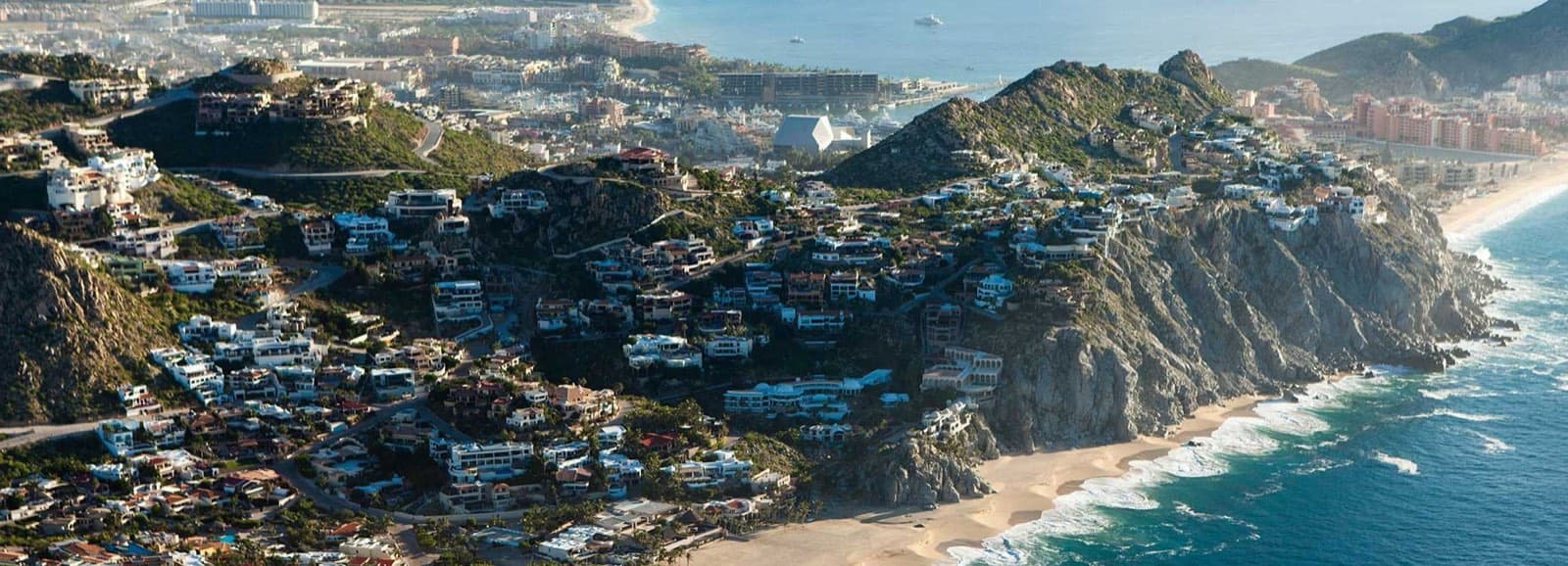 Aerial view of Pedregal homes on the hillside above Cabo San Lucas and the Pacific Ocean