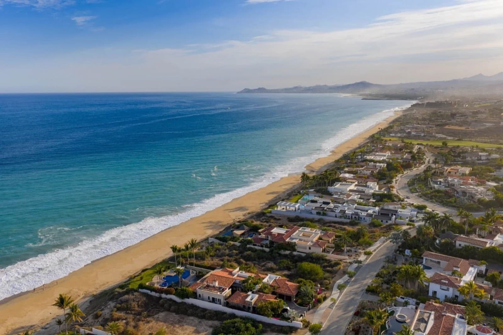 Aerial view of the beach and homes along the coast at Puerto Los Cabos, San José del Cabo
